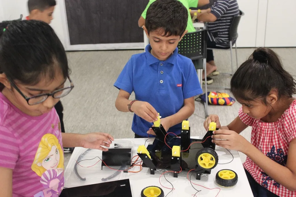 Students assembling DIY Mars Rover Kit